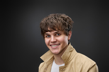 Obraz premium portrait of caucasian man with hairstyle in coat