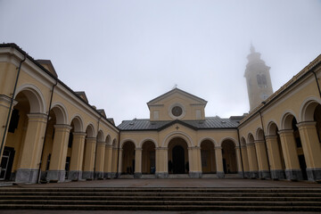 View of the Sanctuary of Our Lady of the Guard (Madonna della Guardia) in the fog, in winter time, in Genoa, Italy.