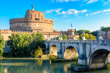 Fototapeta premium Castle of Holy Angel (Castel Sant'Angelo) and St. Angel bridge (Ponte Sant'Angelo) over Tiber river in Rome, Italy