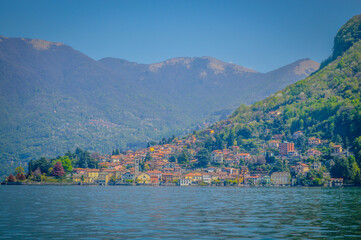 Fototapeta na wymiar Spring in Italy, Lombardy, Milano, Como lake and city. Landscape view on hills, park, old town and water, with some interesting details, close up and panoramic.