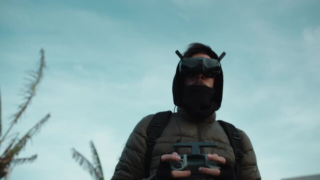 pilot controlling fpv drone through virtual glasses 