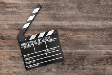 Classic movie clapperboard on wooden desk