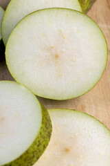 Fresh juicy pear cut into pieces and pieces