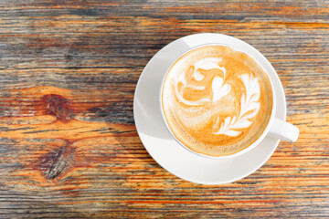 Morning Brew: Top-View of Artistic Latte on a Wooden Table