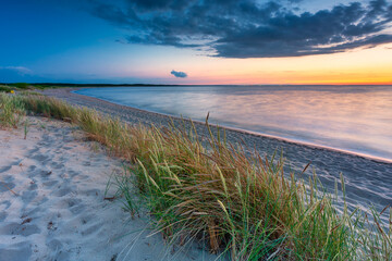 A beautiful sunset on the beach of the Sobieszewo Island at the Baltic Sea. Poland