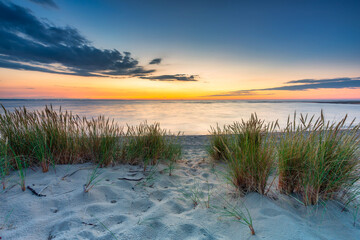 A beautiful sunset on the beach of the Sobieszewo Island at the Baltic Sea. Poland