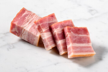 sliced smoked bacon on white marble surface