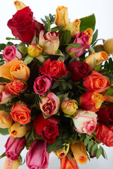 A bouquet of flowers With Green and Yellow and Red...