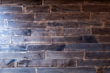 Dark Old parquet wooden texture. with sun light. Natural wood shabby background close-up.