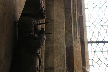 statue of an holy character in the pénity chapel in locronan in brittany (france)