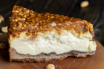 Cheesecake made of dairy products and peanuts in caramel