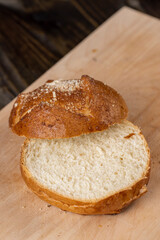 Wheat bun with large pieces of processed cheese inside