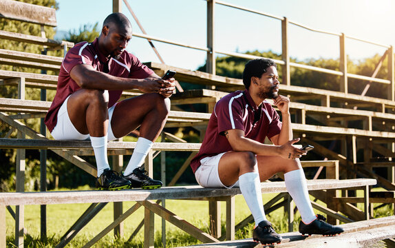 Rugby break, phone and men or team for social media update, sports fitness planning and blog tips. Relax, ideas and 5g networking of athlete or black people on smartphone for website or online chat - Powered by Adobe