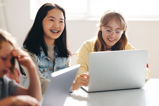 Elementary school children enjoying a coding class at school