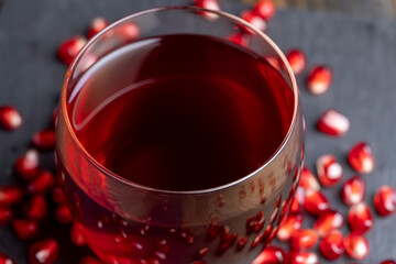 Sweet and sour pomegranate juice in a transparent glass
