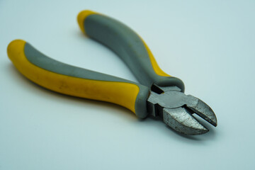 Obraz premium Rusty combination cutting pliers isolated on gray