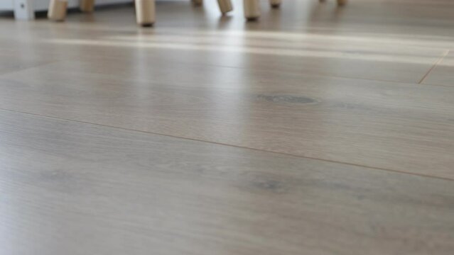 New laminate flooring. Laminated parquet with brown wooden texture