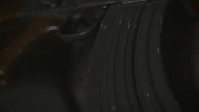 Low key photo of AK-47 Kalashnikov rifle. Dark themed automatic rifle from Russia/Soviet union.	