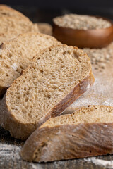 Cut into pieces fresh baked loaf of dark bread