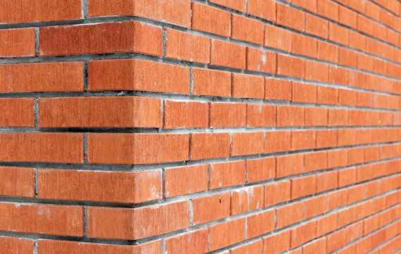 Fototapeta Corner of red brick wall. Abstract background photo