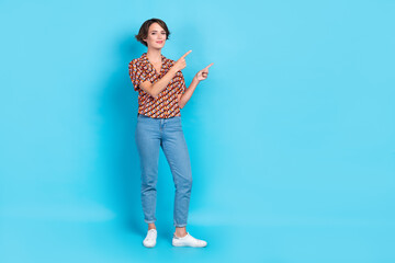 Full body photo of nice positive lady direct fingers empty space proposition isolated on blue color background