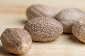 A whole nutmeg fruit on the kitchen table