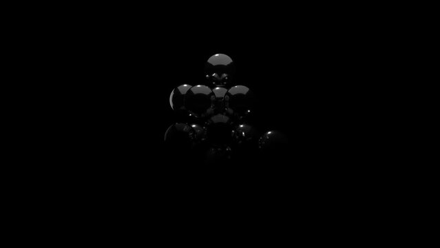 metal balls moving against a black and white background
