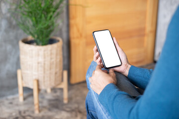 cell phone blank white screen mockup.hand holding texting using mobile on desk at office.background empty space for advertise.work people contact marketing business,technology