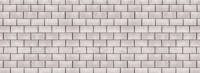 Photo of long horizontal white gray brick wall