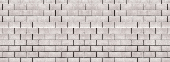 Photo of long horizontal white gray brick wall