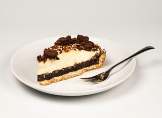 Cake slice on white plate with fork carrot pie apple chocolate crunch cookie vanilla cream 