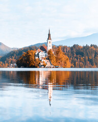 Colorful autumn view of Bled lake in Julian Alps, Slovenia. Pilgrimage church of the Assumption of...
