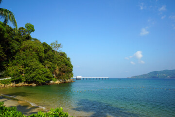 View of the sea and the bridge pier in Patong Beach. Phuket Province, Thailand