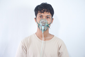 unhealthy young man wearing oxygen mask