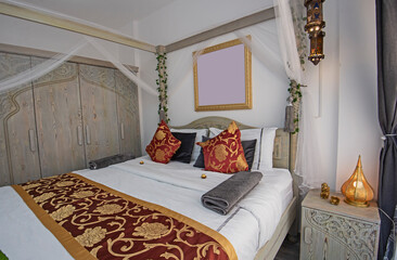 Interior design of double bedroom in house with four poster bed