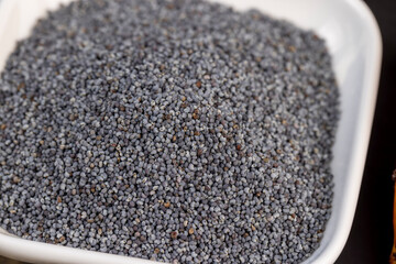 A large number of poppy seeds on the cooking table