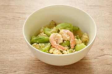 stir fried ridge gourd with egg and shrimp on bowl