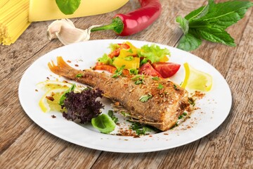 Tasty fresh Dish with fish fillet and salad