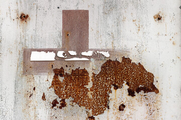 Flaking paint from the metal surface