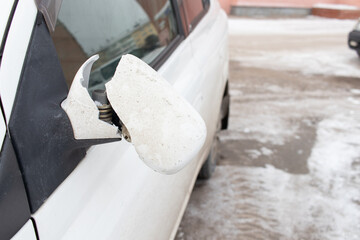 Car with broken rearview mirror