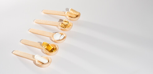 Spoons with vitamins, Vitamin D, omega 3, omega 6, Food supplement oil filled fish oil, vitamin A, vitamin E, flaxseed oil	