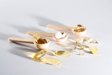 Spoons with vitamins, Vitamin D, omega 3, omega 6, Food supplement oil filled fish oil, vitamin A, vitamin E, flaxseed oil	
