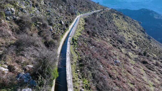 Aerial view from a drone of the landscape around the Juncal channel under Arma&ntilde;&oacute;n and Los Jorrios near the Juncal reservoir and the Las Nieves hermitage. Angostina. Cantabria. Spain. Europe