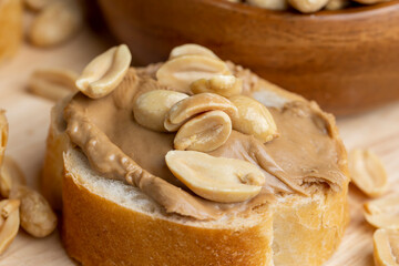 Peanut paste on a soft wheat baguette