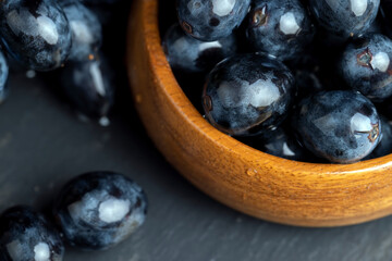 sweet ripe black grapes covered with drops of water
