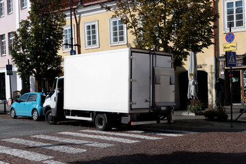 Blank truck mockup in the urban environment, empty space to display your advertising or branding campaign