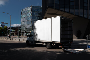 Blank truck mockup in the urban environment, empty space to display your advertising or branding...