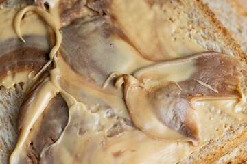Peanut paste with chocolate paste on white bread