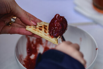 Preparing waffle or waffles with jam, dish made from leavened butter or dough that is cooked...