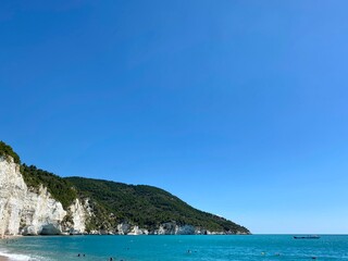 Fototapeta na wymiar Scenic view Blue Water White Cliffs Vignanotica Beach Gargano National Park Italy